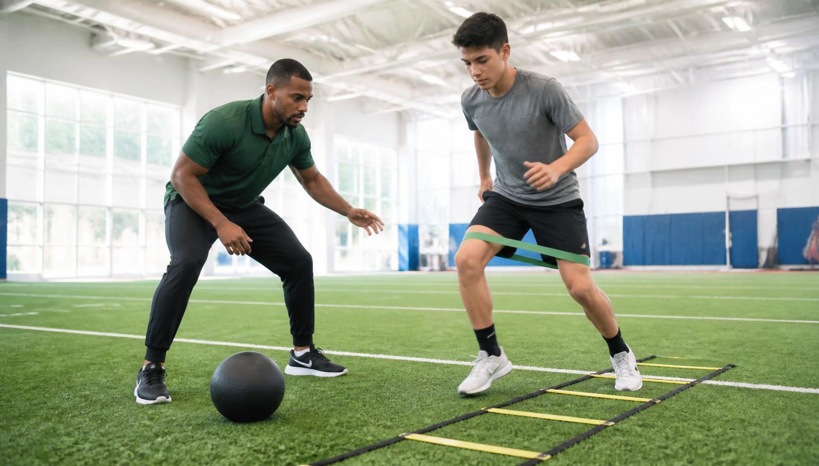 One-on-one personal training session on the turf