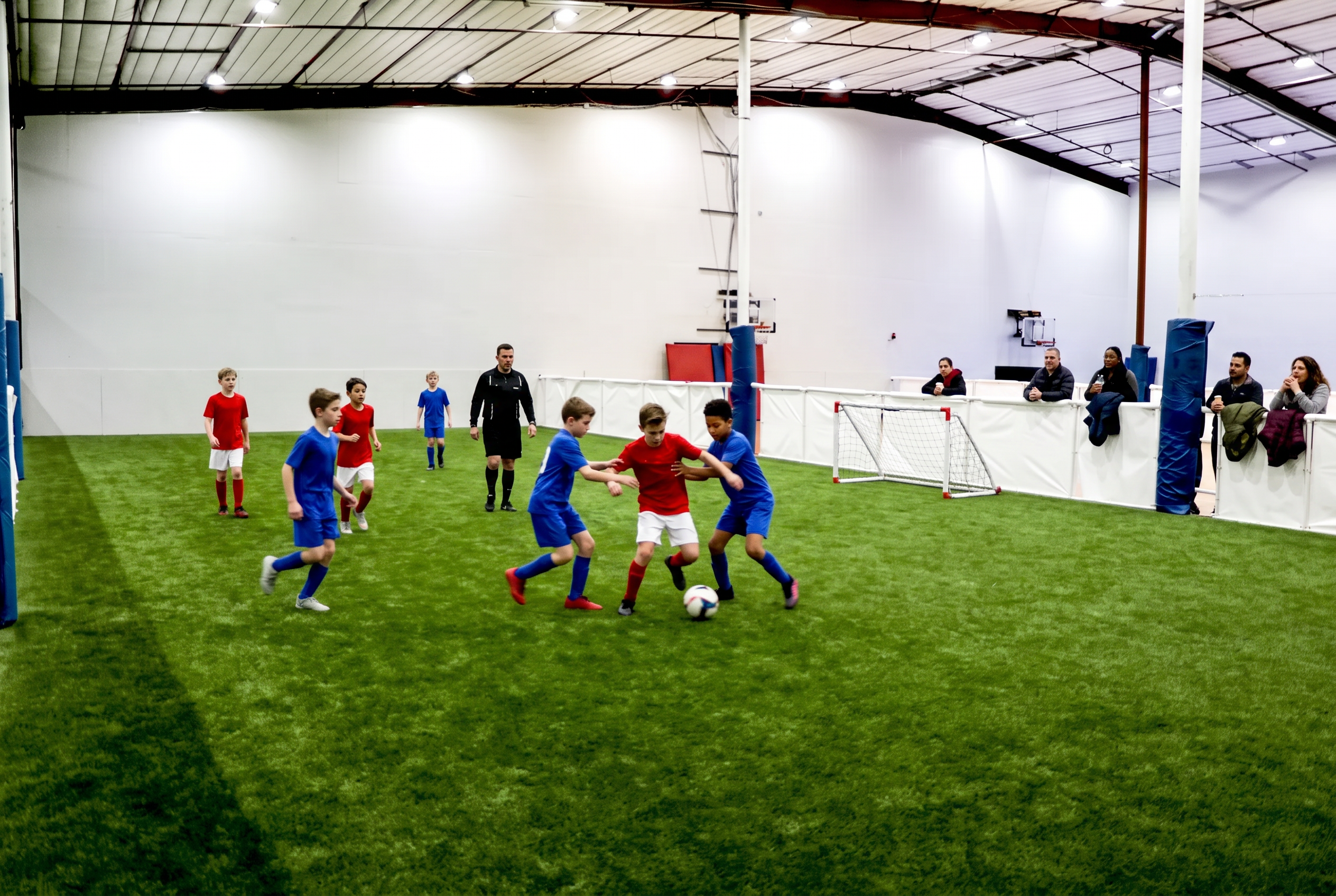 Youth soccer tournament match on the indoor turf field